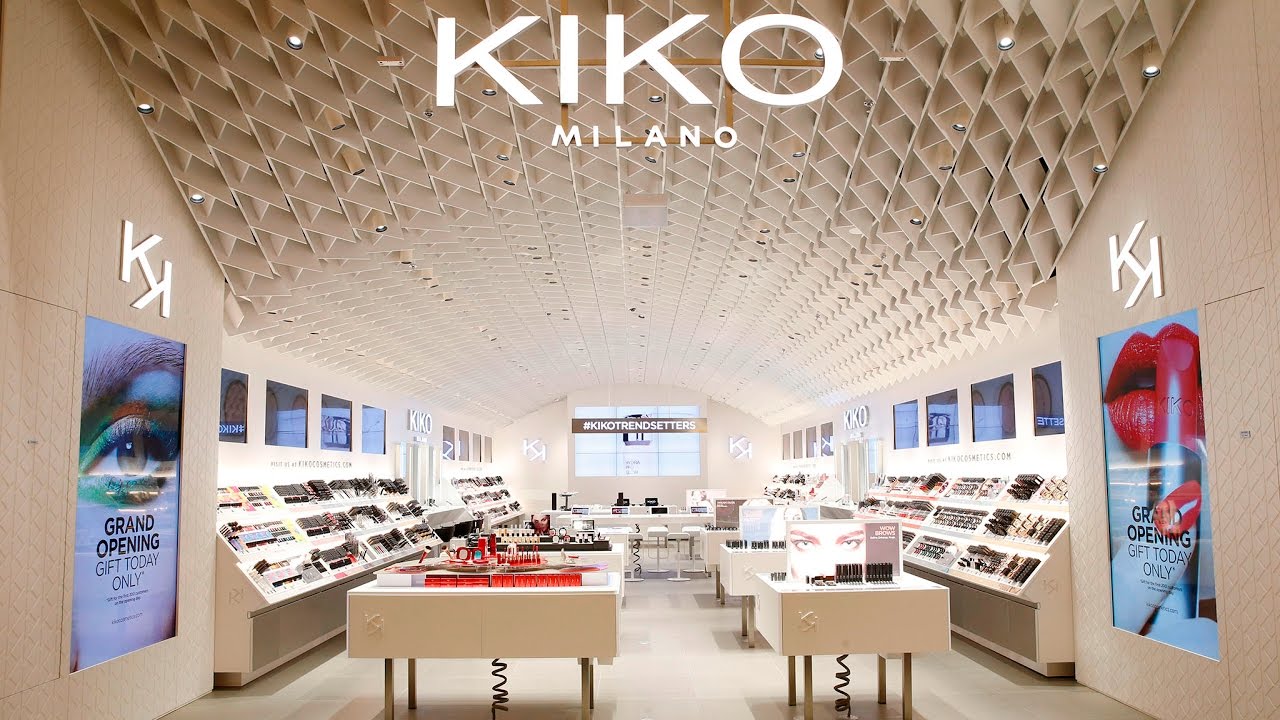 The interior of a KIKO Milano store, with make-up stations and brand screens