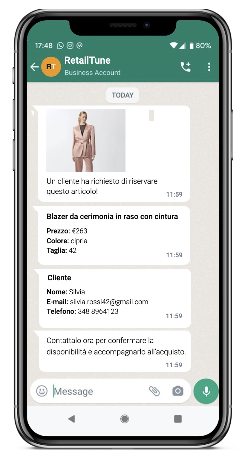 The WhatsApp chat received by the store: a customer has asked to reserve a formal blazer, with photo, price, size and contact details to follow up